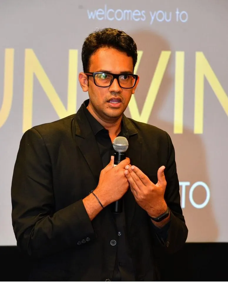 Ramalingam speaking on stage